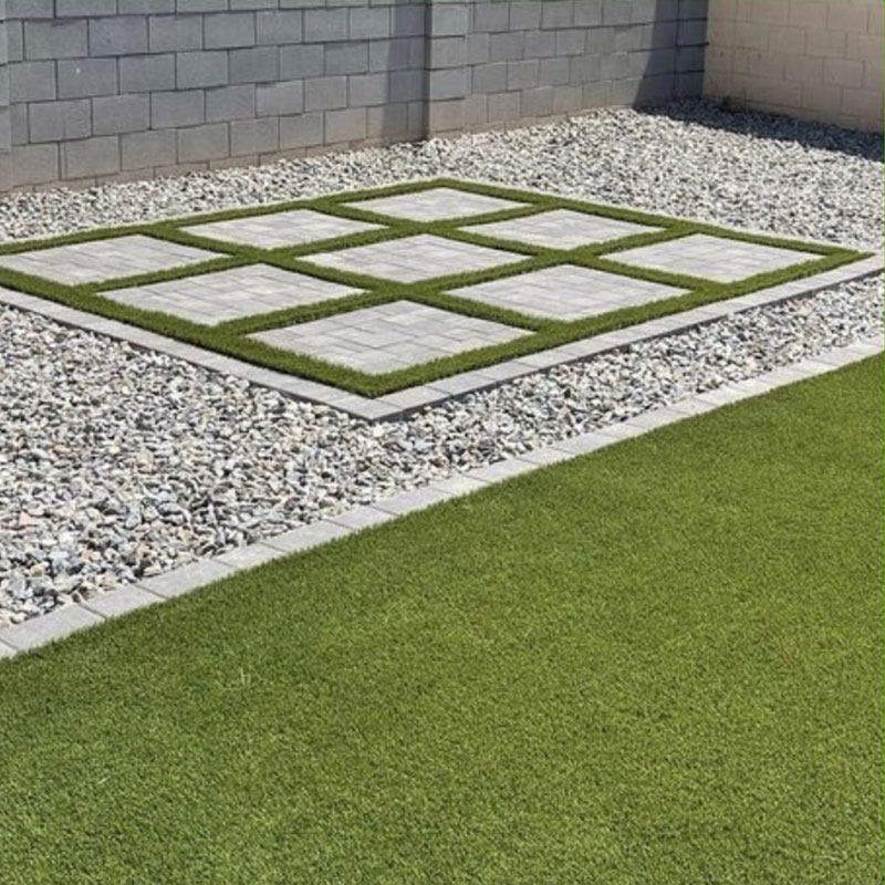 Landscaping with rocks, tile and turf