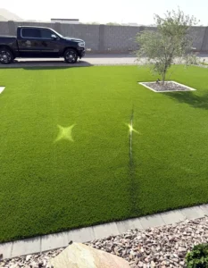 Concentrated sunlight reflected from a window onto artificial turf, showing the burn path created as the sun moves